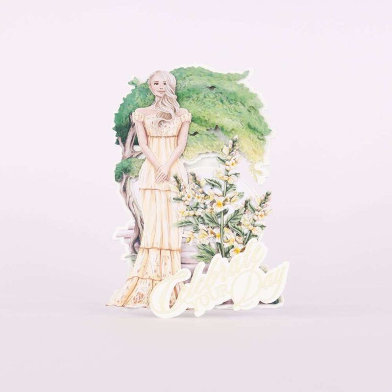 Card made using Summer Celebrations Special Edition Vignette with a woman standing in front of floral and tree