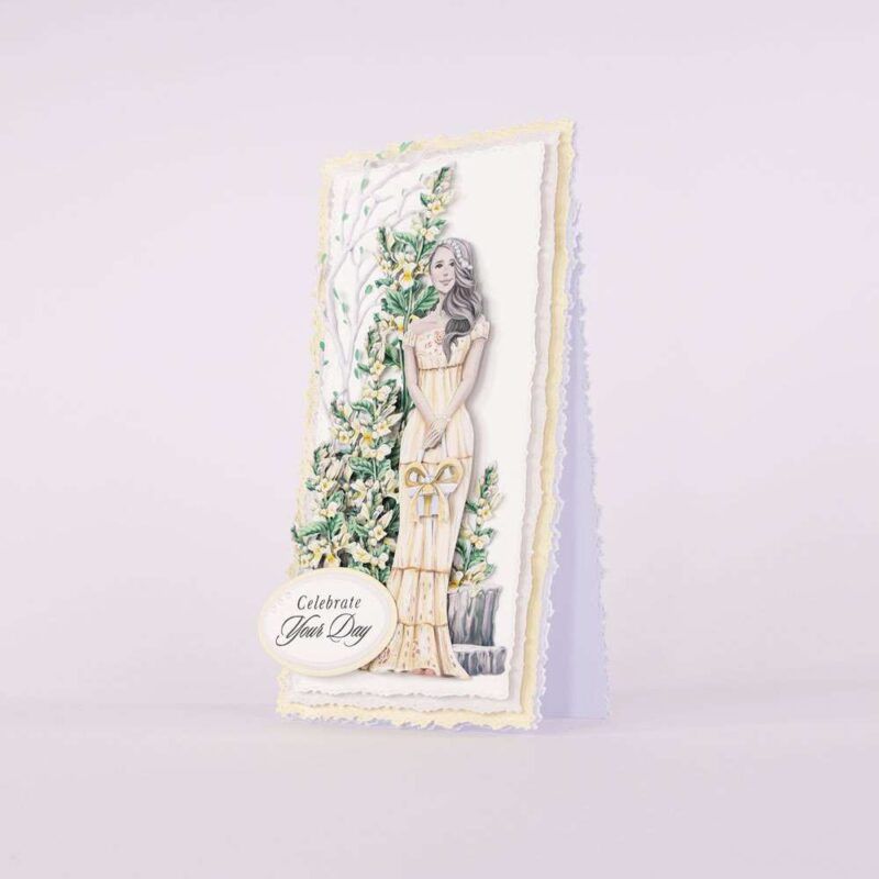 Card made using Summer Celebrations Special Edition Vignette with a woman holding a gift in front of a floral tree