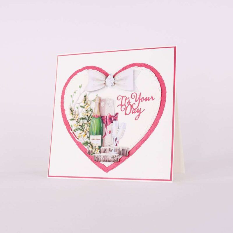 Card made using Summer Celebrations Special Edition Vignette with a bottle of bubbly and two glass es in a love heart frame