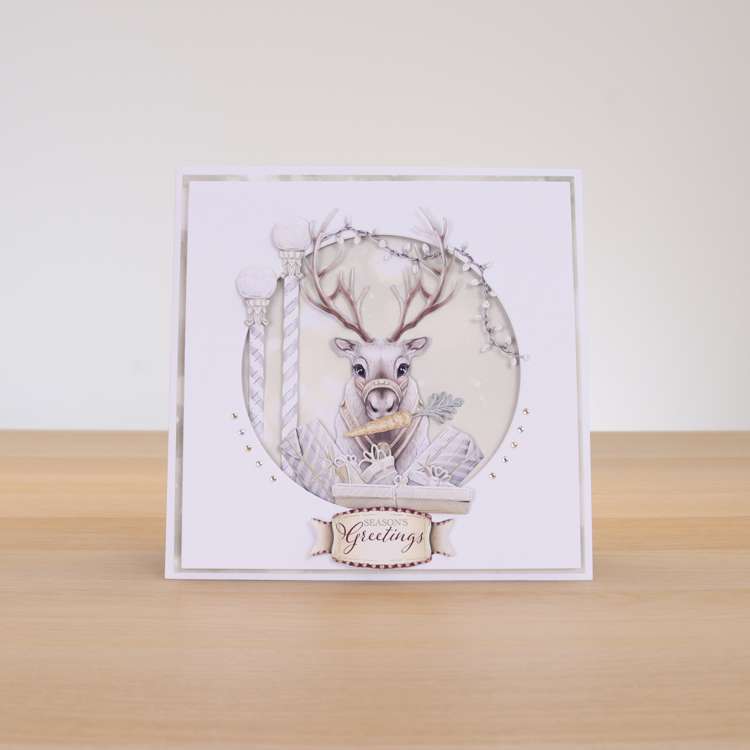 Card made using ready For A White Christmas Special Edition Vignette with a reindeer in the centre of a circle frame