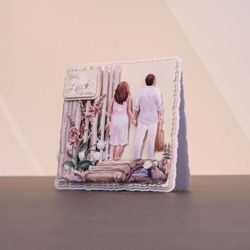 Card made using the Sunny Escape Special Edition Vignettes with a man and woman holding hands looking into the distance stood on a wooden bridge