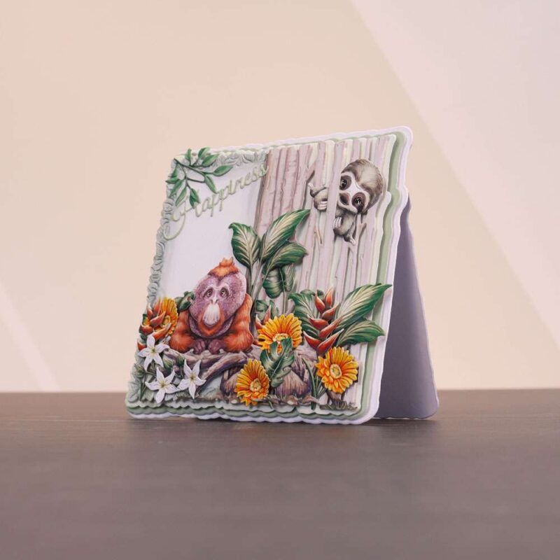 Card made using the Sunny Escape Special Edition Vignettes with an orangutan and sloth surrounded by florals
