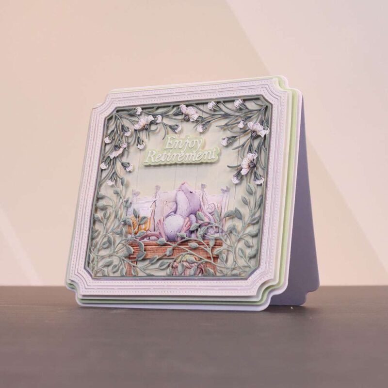 card made using the Sunny Escape Special Edition Vignettes with a mouse relaxing on an outdoor bench surrounded by floral vines