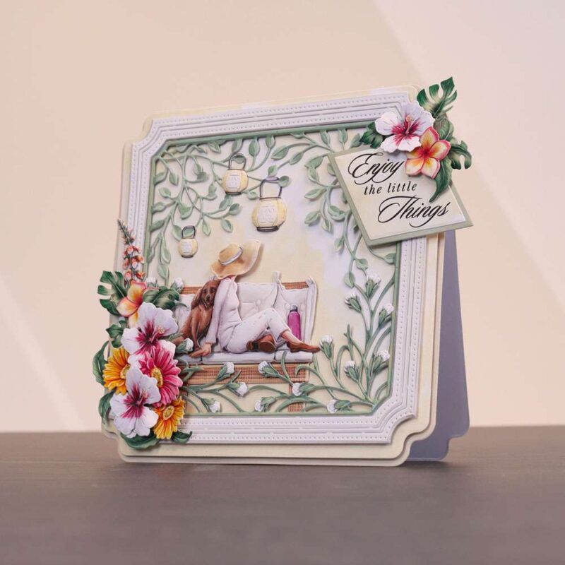 Card made from the Sunny Escape Special Edition Vignettes with florals and a dog resting on a sat down woman
