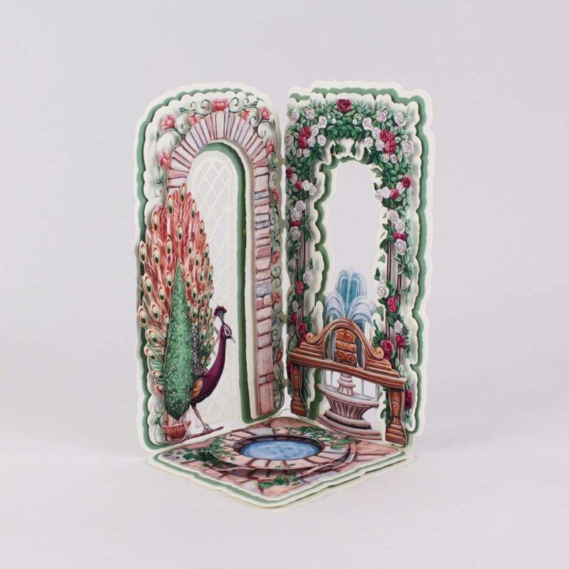 Card made using the Grand Gardens Special Edition Vignette with a wishing well and peacock looking over