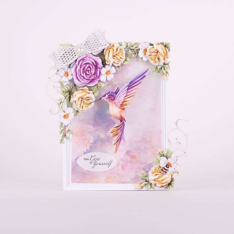 Card made using Garden Grace Special Edition Vignette with a hummingbird in the centre, roses on the top and a bow over the top of them
