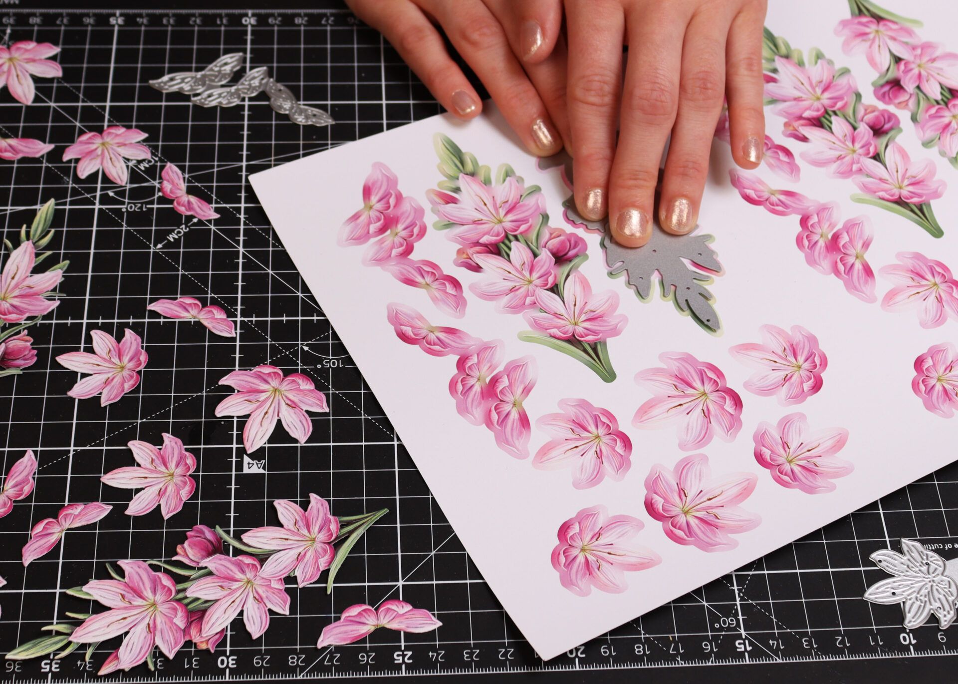Hands placing a die to cut artwork