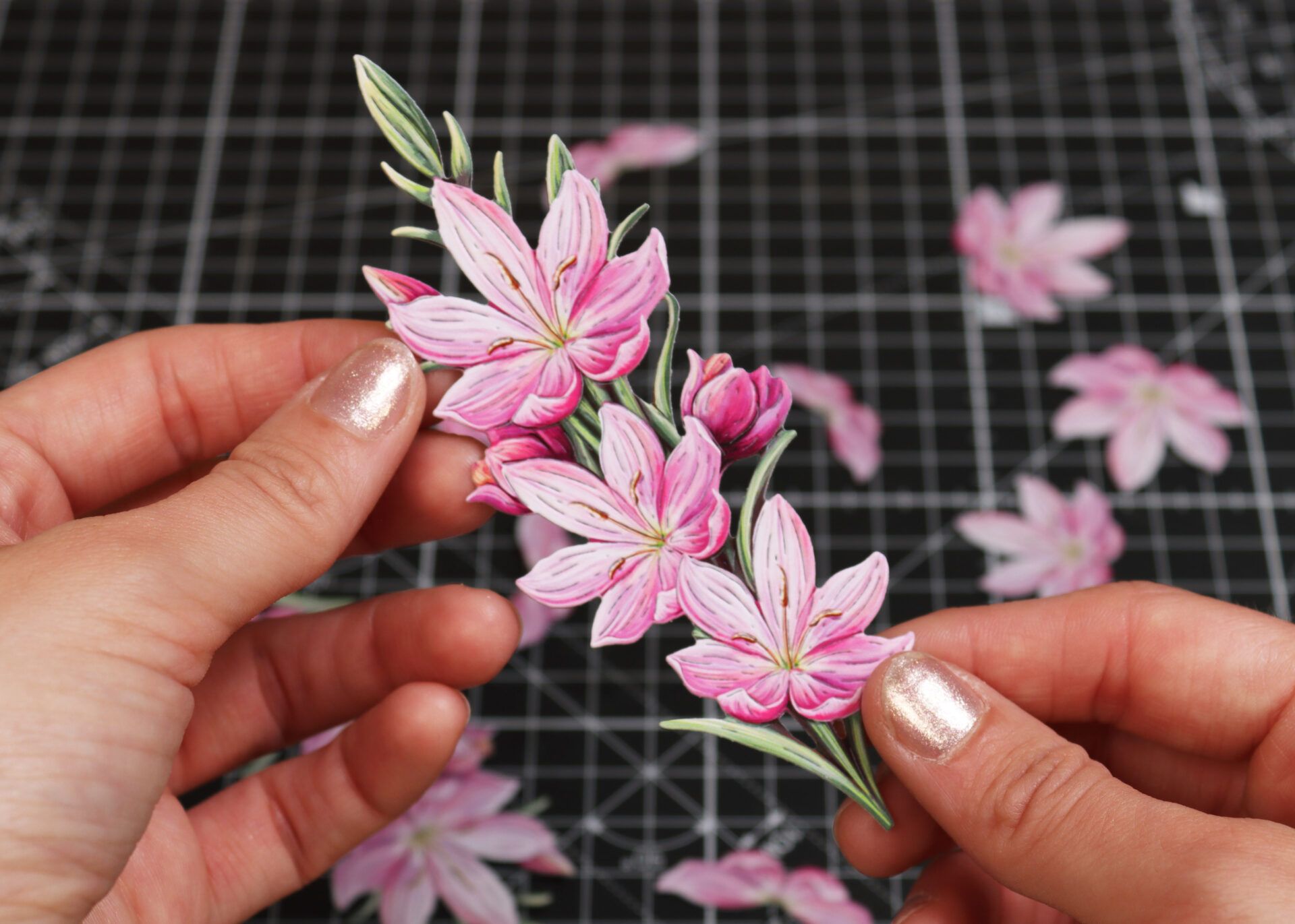 Hands showing a piece of die cut artwork