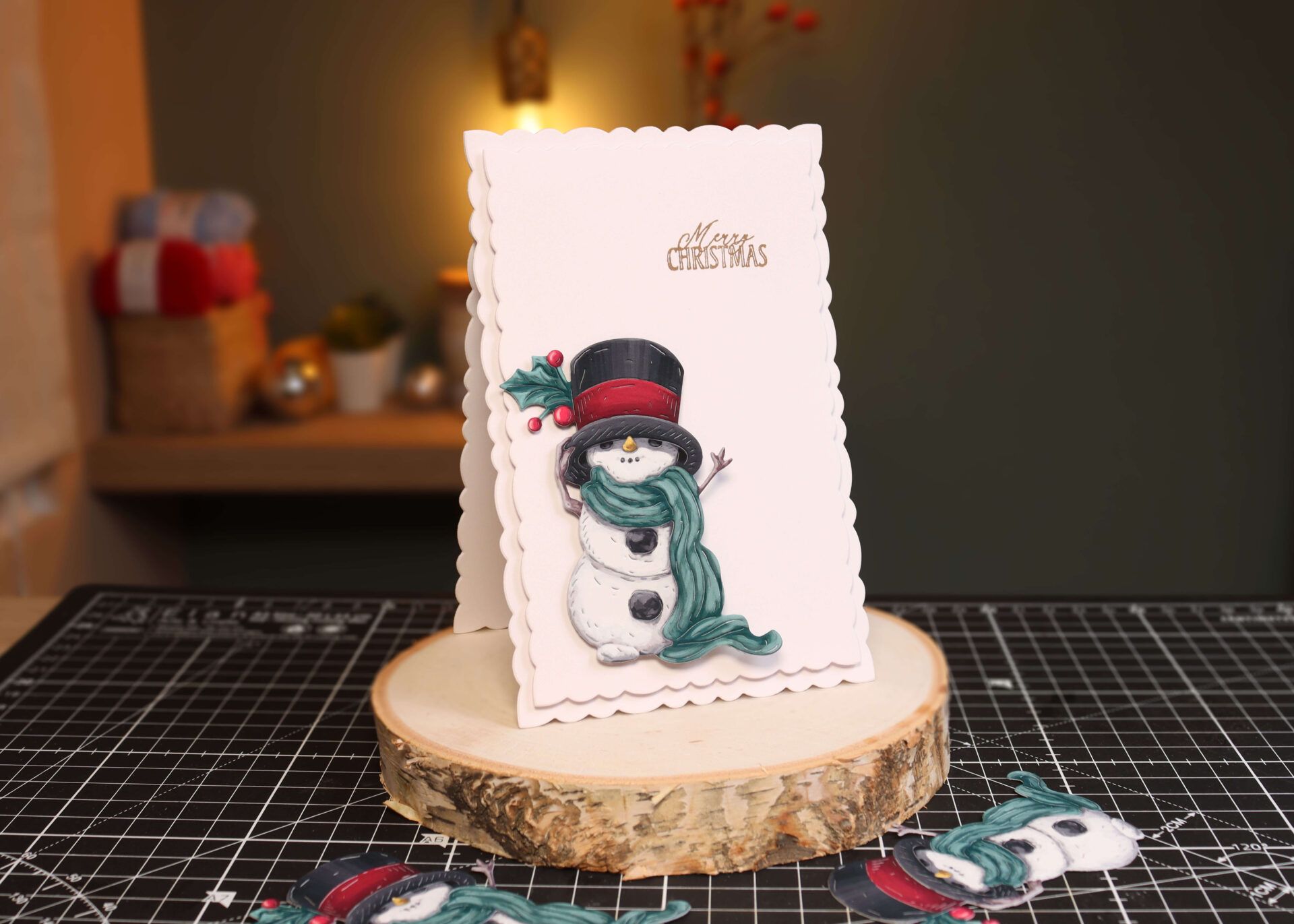 A simple Christmas card with snowman topper