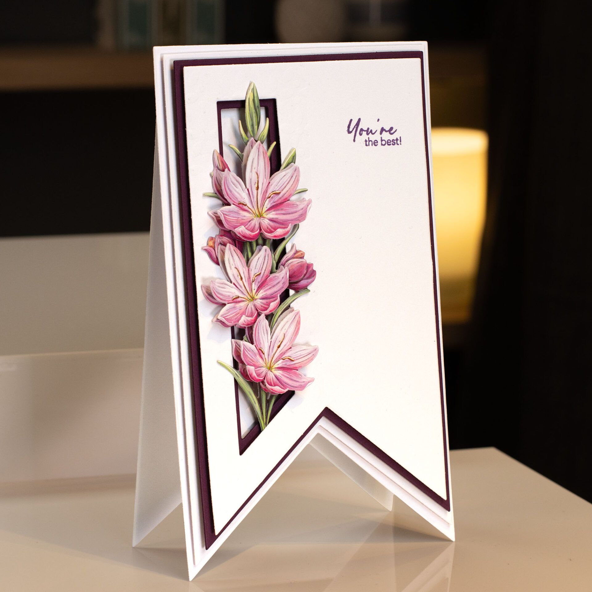 a card with pink flowers made from a metal die cutting set