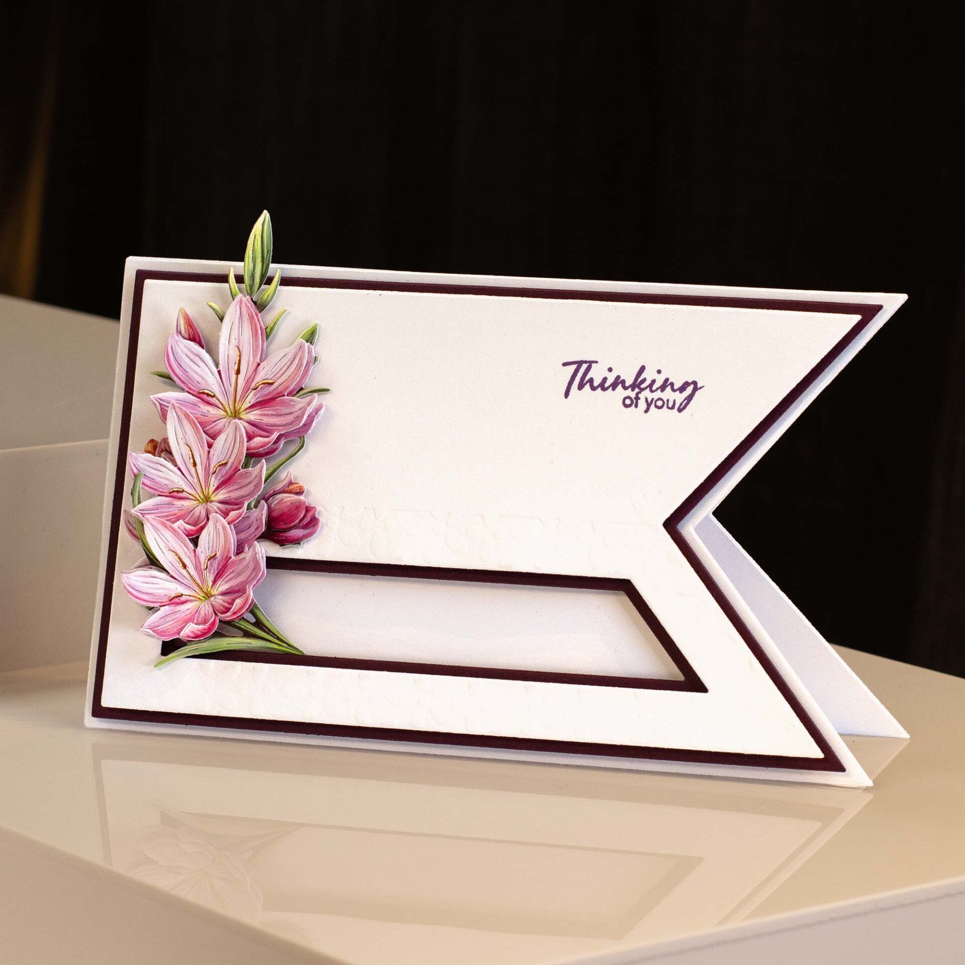 a simple card with pink flowers made from a die cutting set, turned 90 degrees to the left